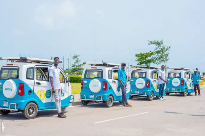 Drivers standing beside 3-wheelers